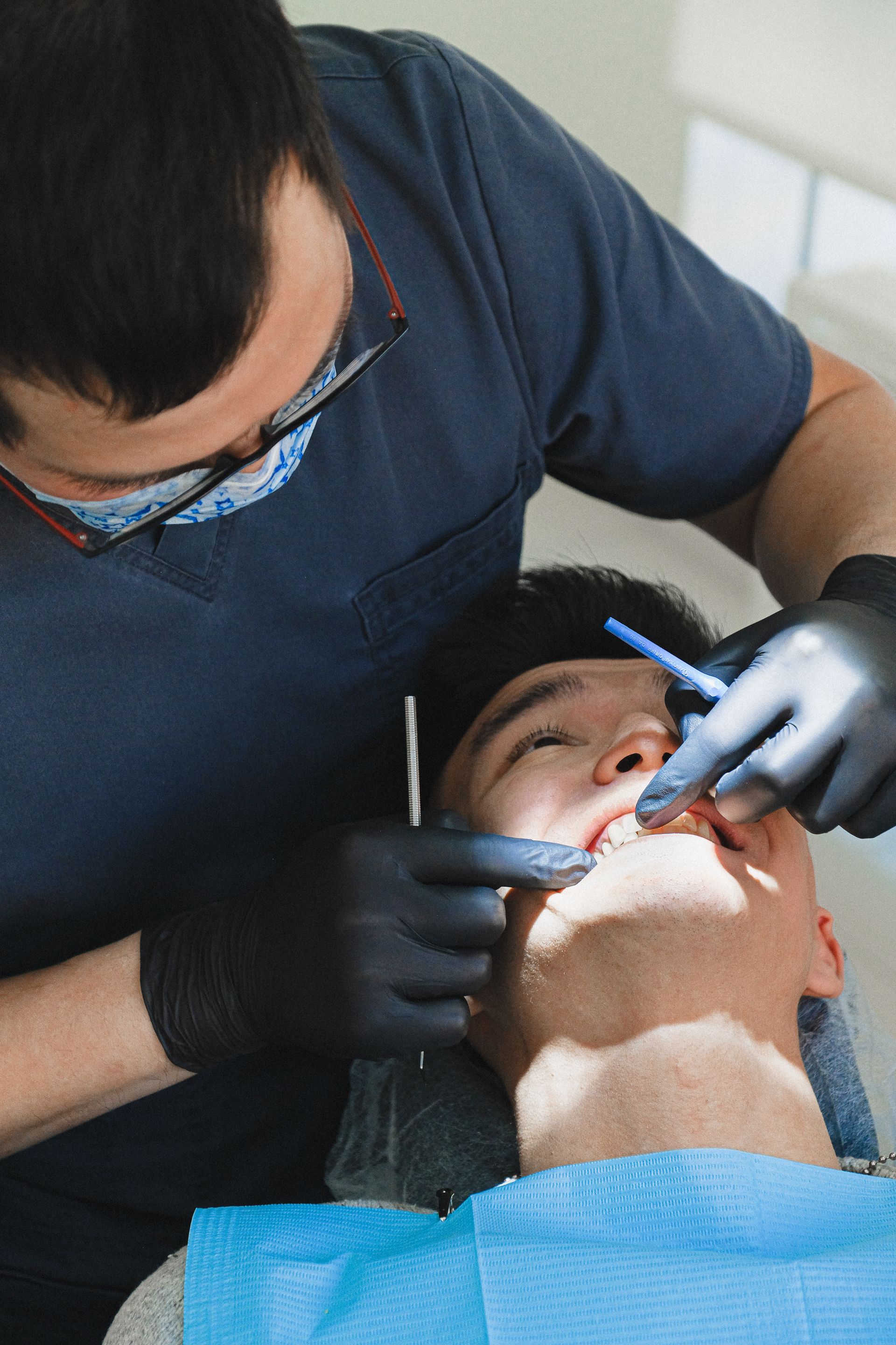 Endodontist examining patient for cracked tooth diagnosis
