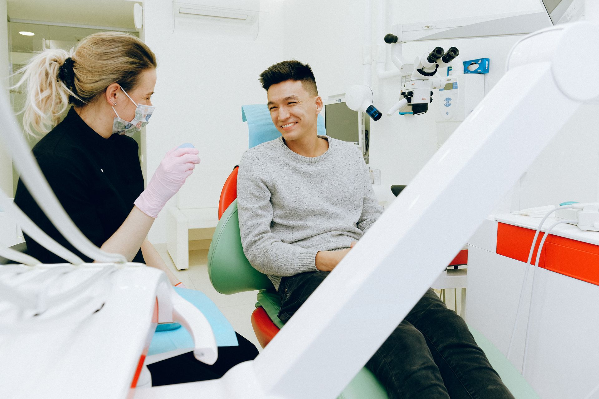 Patient smiling in dental chair after root canal therapy